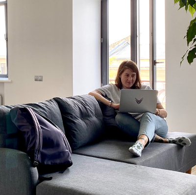 Woman sitting behind laptop