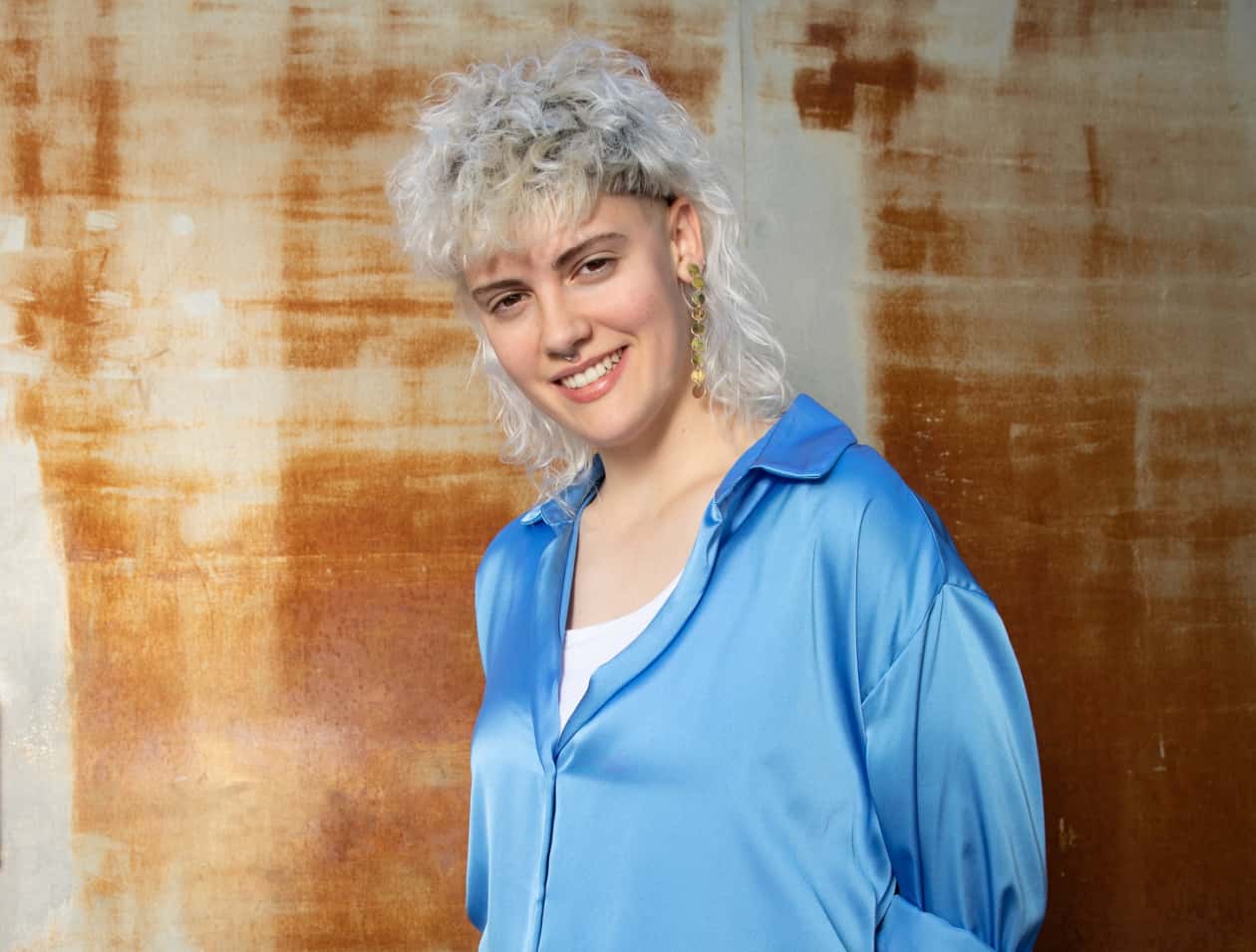 Woman in blue standing